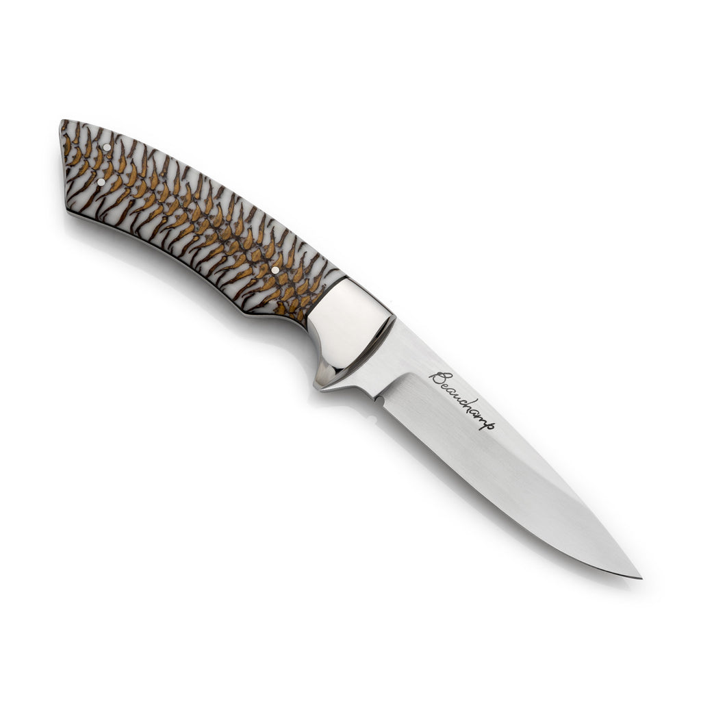 White and gold pine cone knife